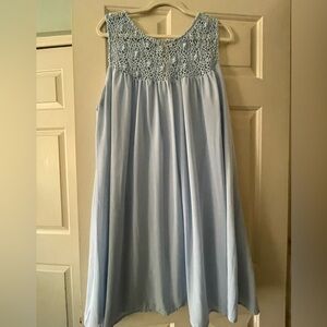 Blue sleeveless flowy dress.